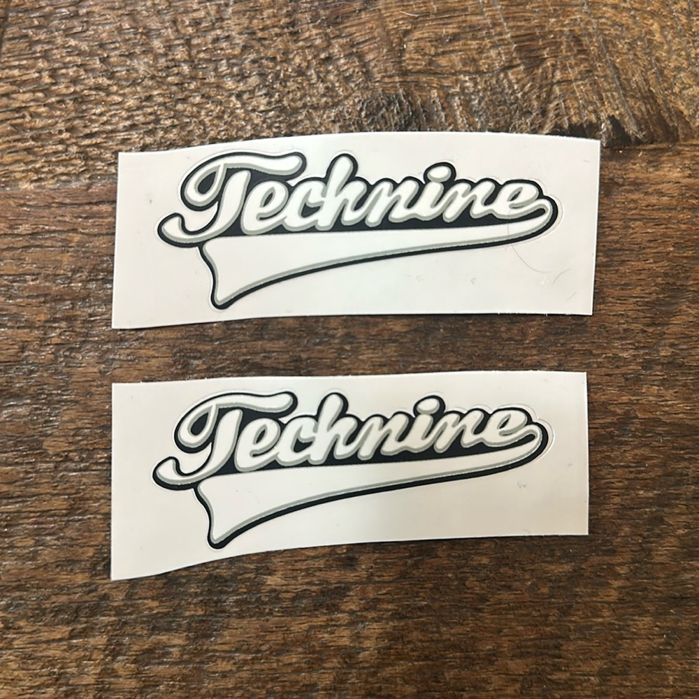 Two Technine stickers